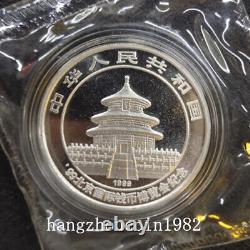 Exposition Internationale de la Monnaie de Beijing en Chine 1999 - Panda en Argent, 10 YUAN, 1 once.